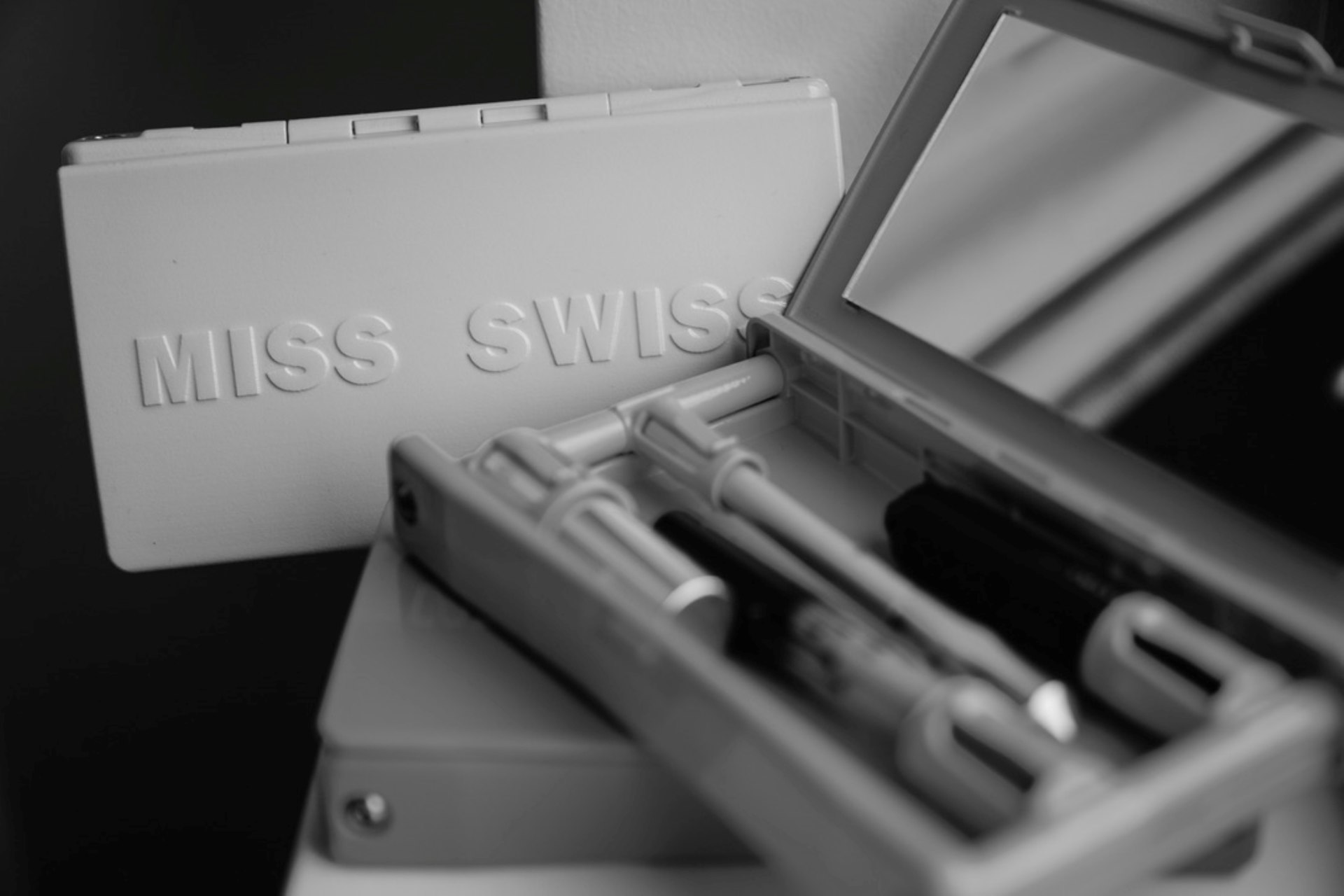 silver and black tools in box